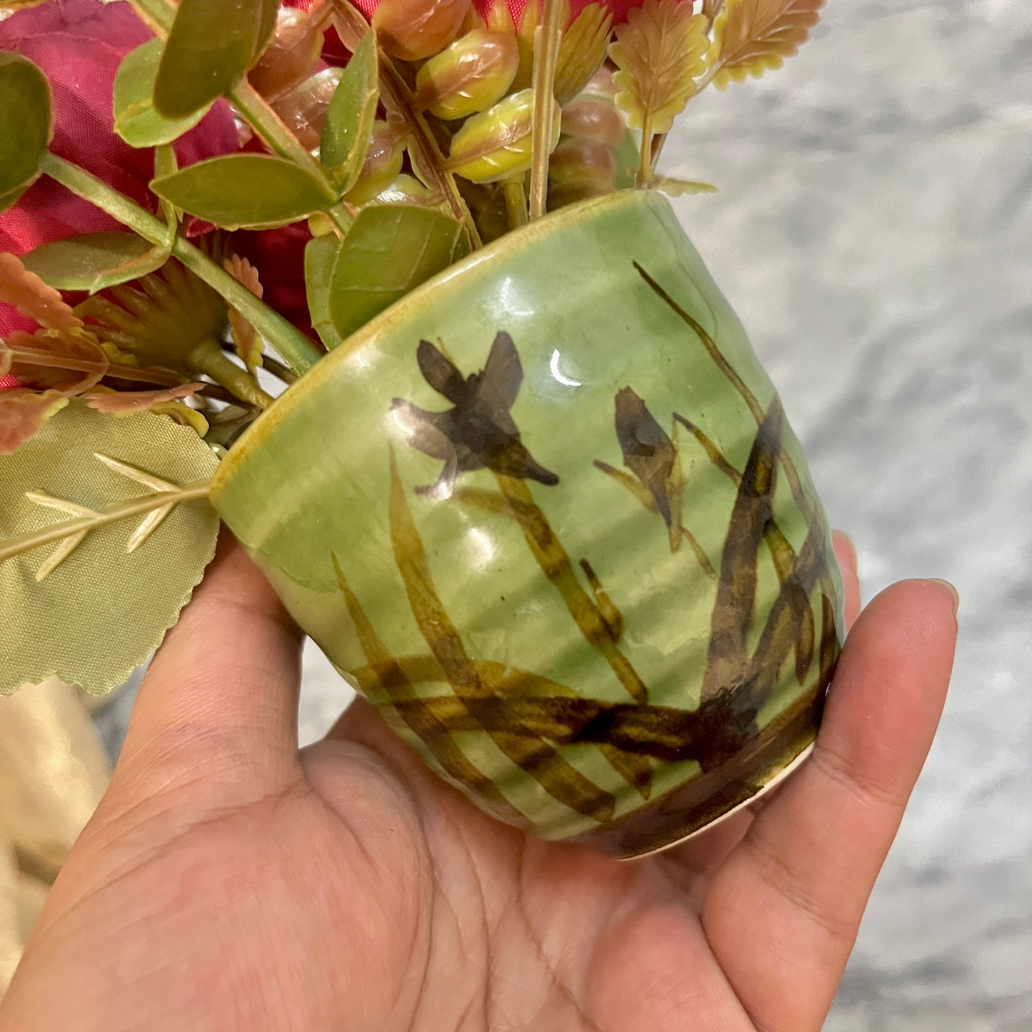 Ancient style green pot with Red Roses